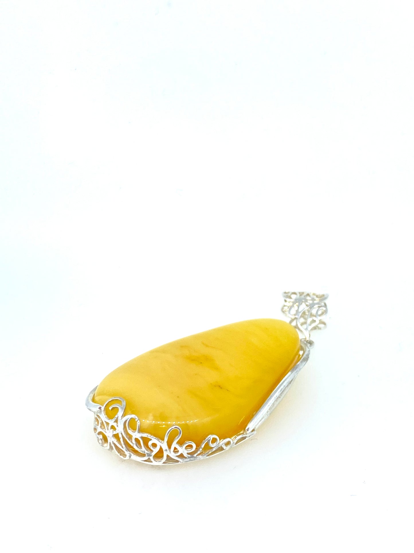 Large yellow Amber and fancy bezel Pendant