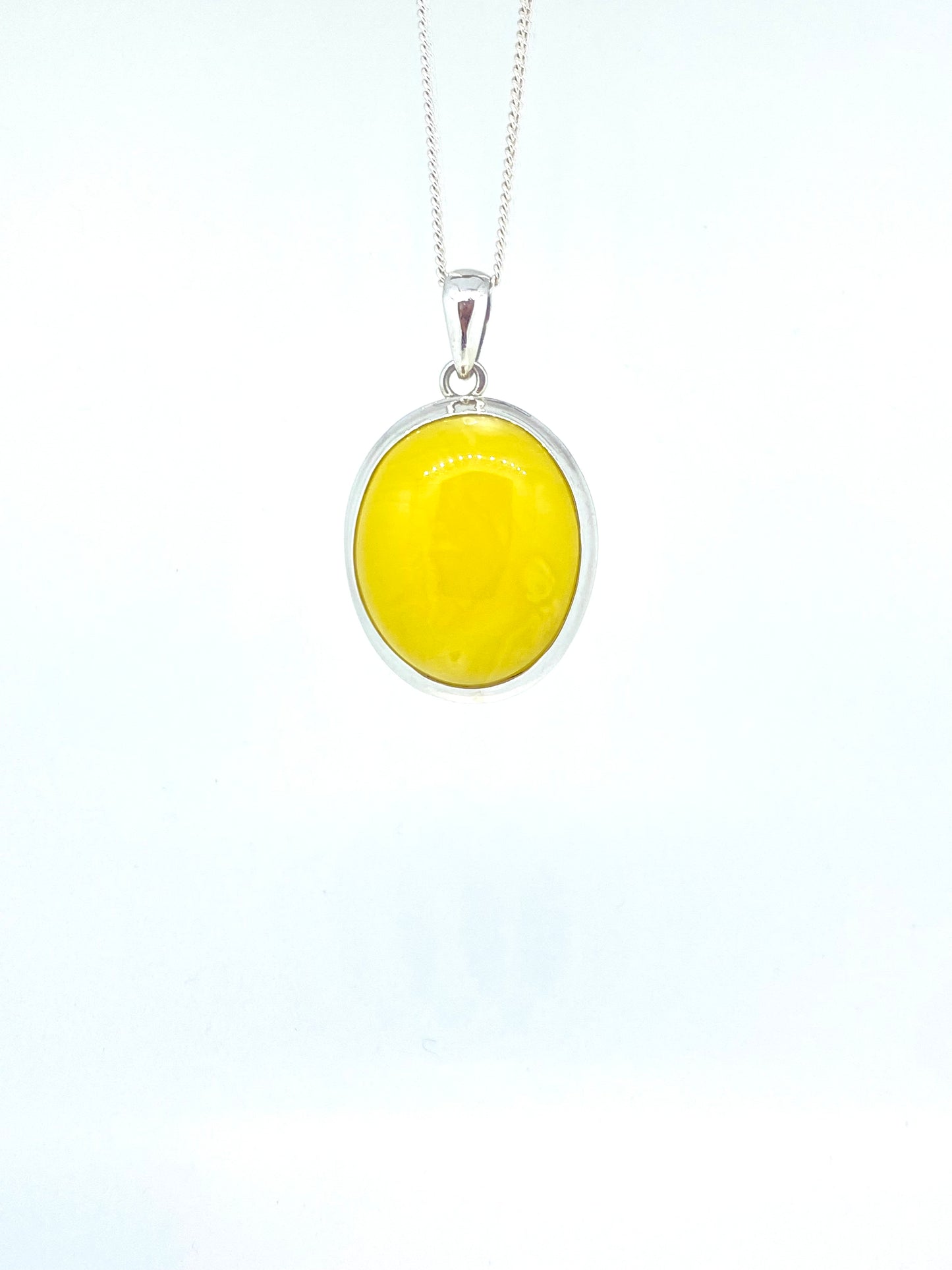 Open back bezle yellow amber pendant