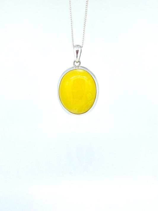 Open back bezle yellow amber pendant