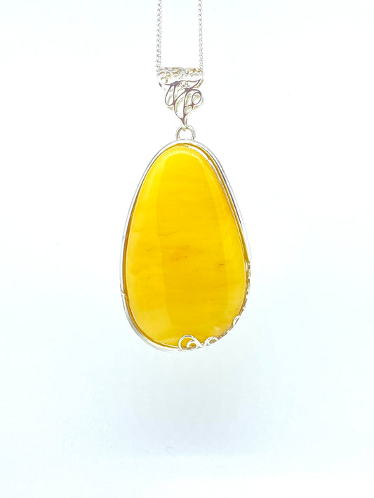 Large yellow Amber and fancy bezel Pendant