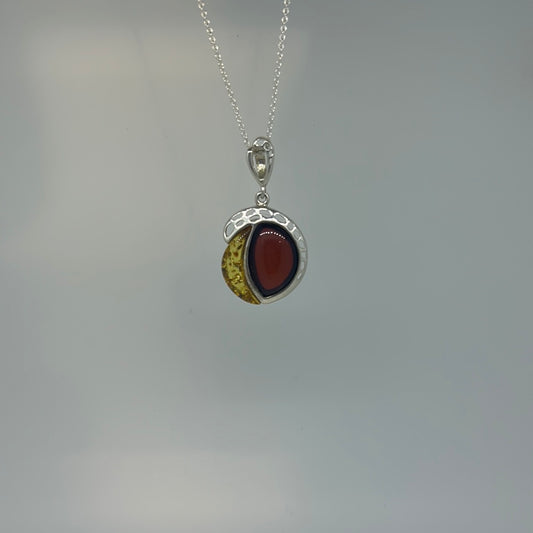 Two tone Amber disc with cutout pendant