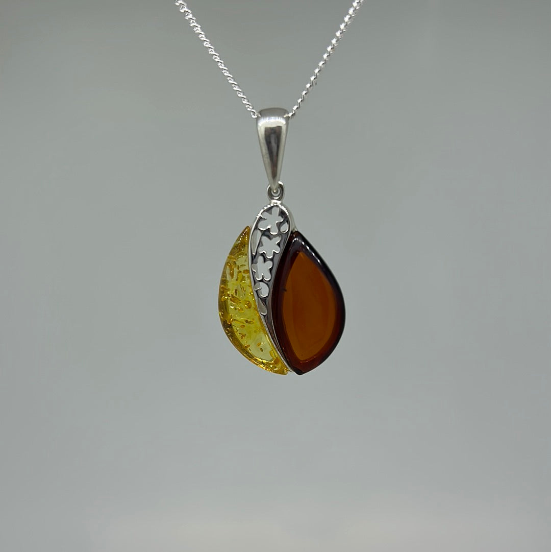 Two tone amber and flower cut out pendant